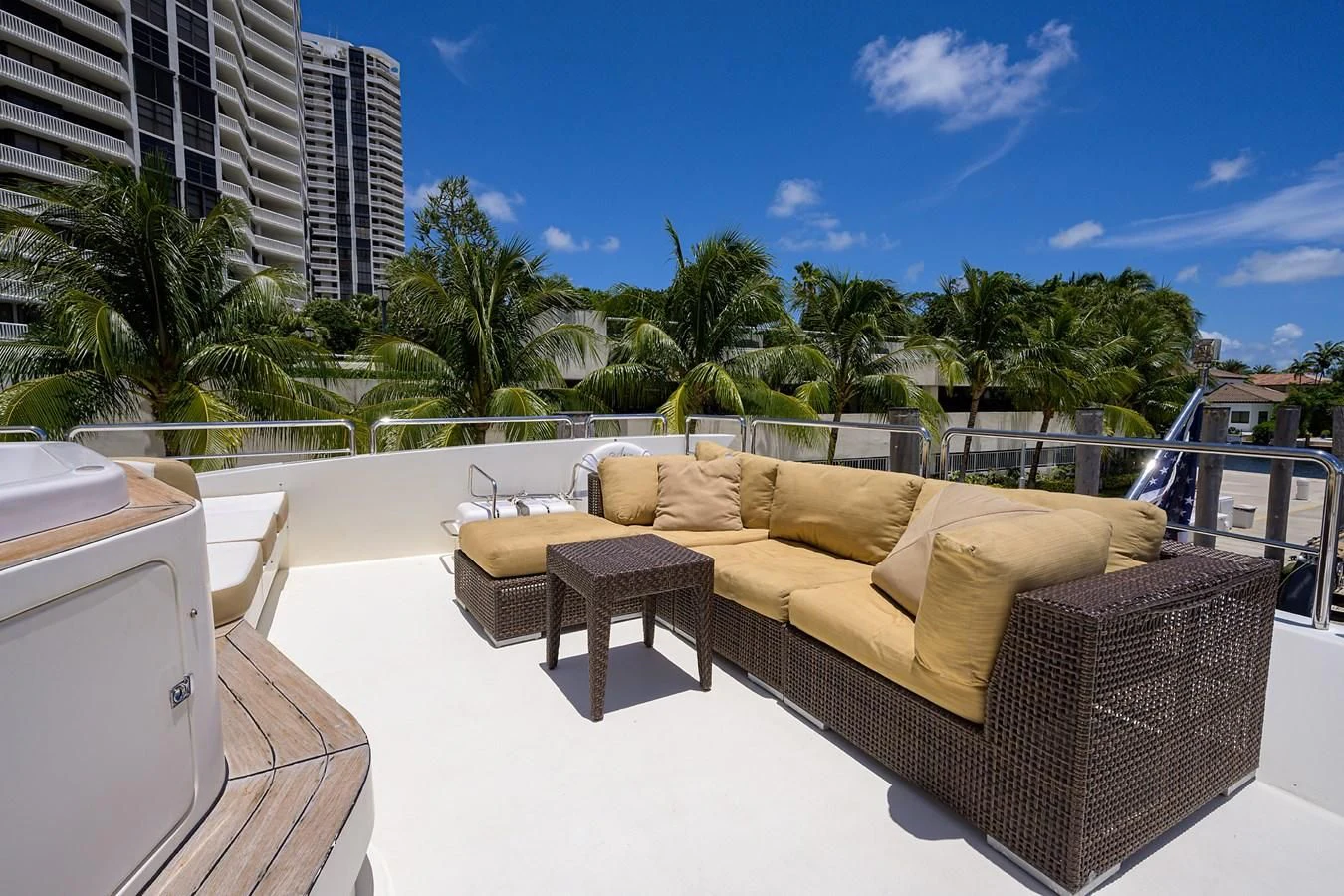 a patio with a couch and a table and chairs aboard AVA Yacht for Sale