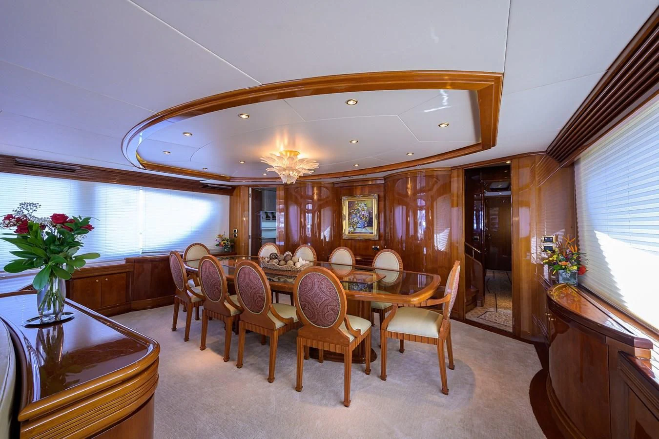 a dining room with a large table aboard AVA Yacht for Sale