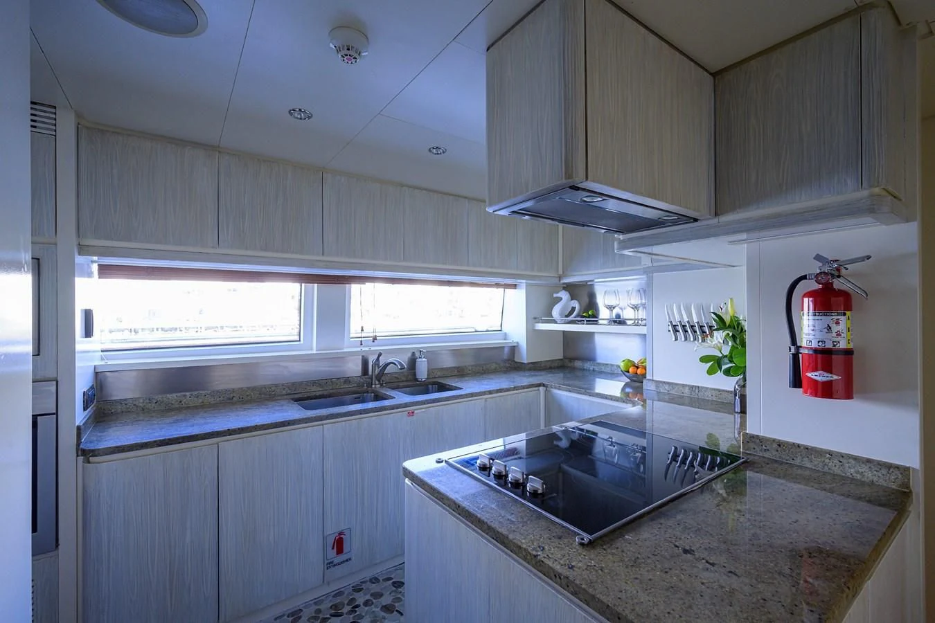 a kitchen with a red and white canister on the counter aboard AVA Yacht for Sale