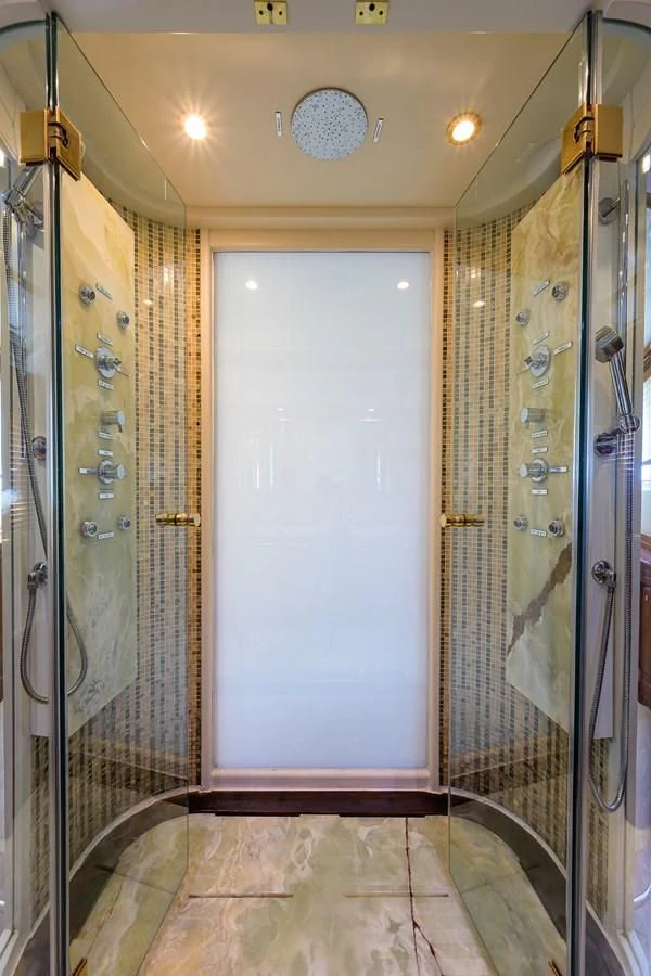 a bathroom with a door aboard AVA Yacht for Sale