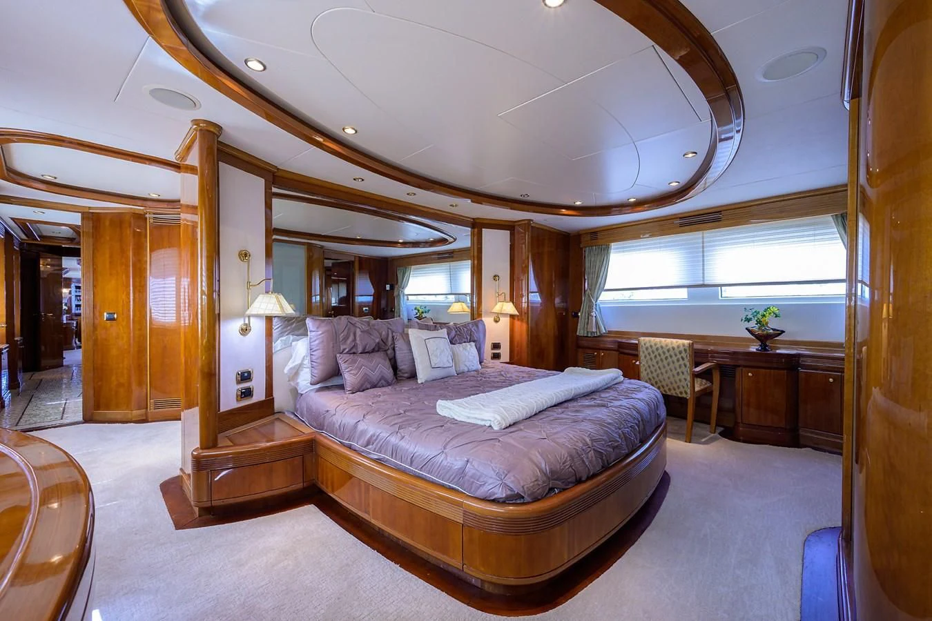 a large bedroom with a large bed aboard AVA Yacht for Sale