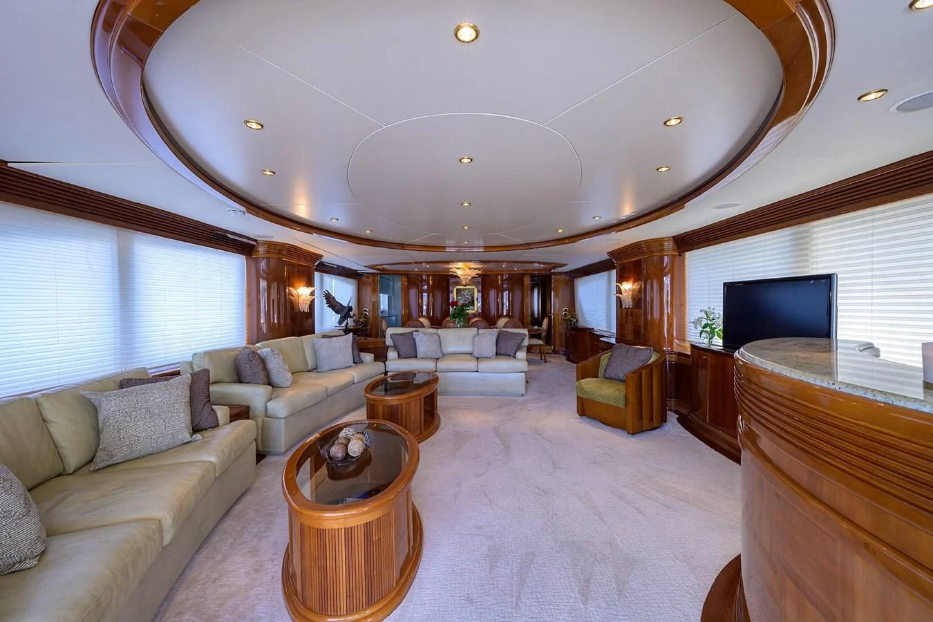 a living room with a large chandelier aboard AVA Yacht for Sale