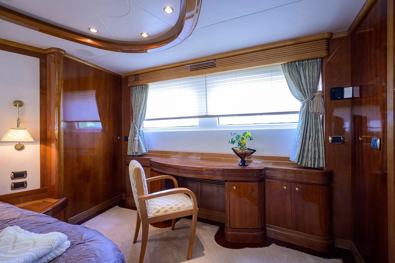 a room with a desk and a bed aboard AVA Yacht for Sale