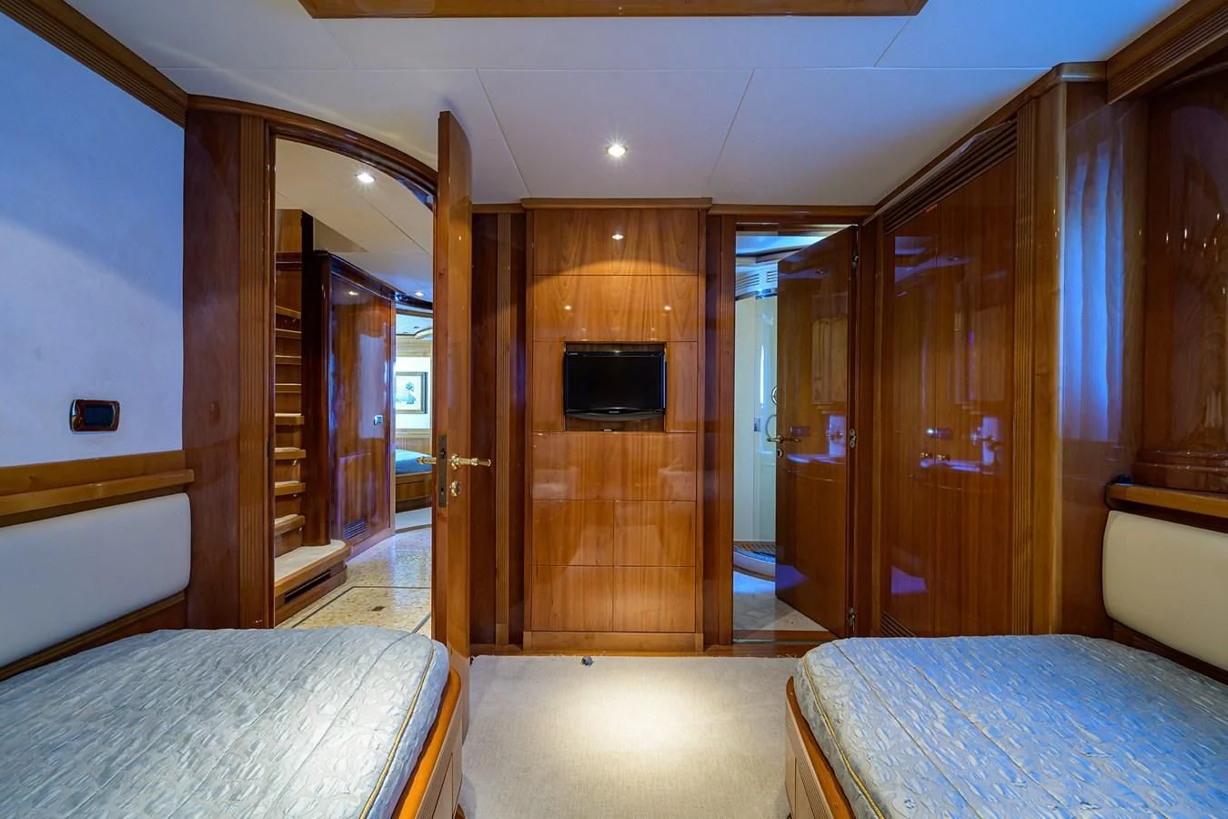 a bedroom with a bed and a television aboard AVA Yacht for Sale