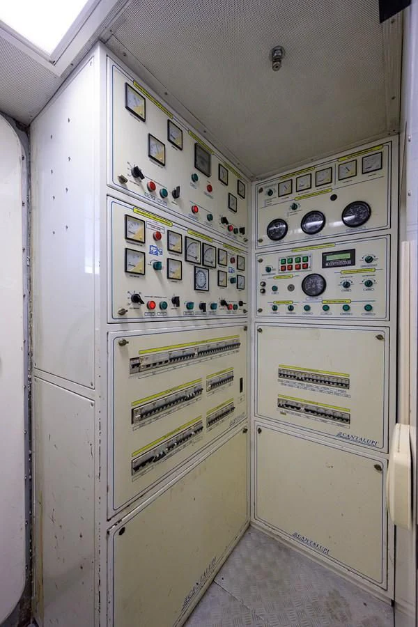 a white cabinet with buttons and knobs aboard AVA Yacht for Sale