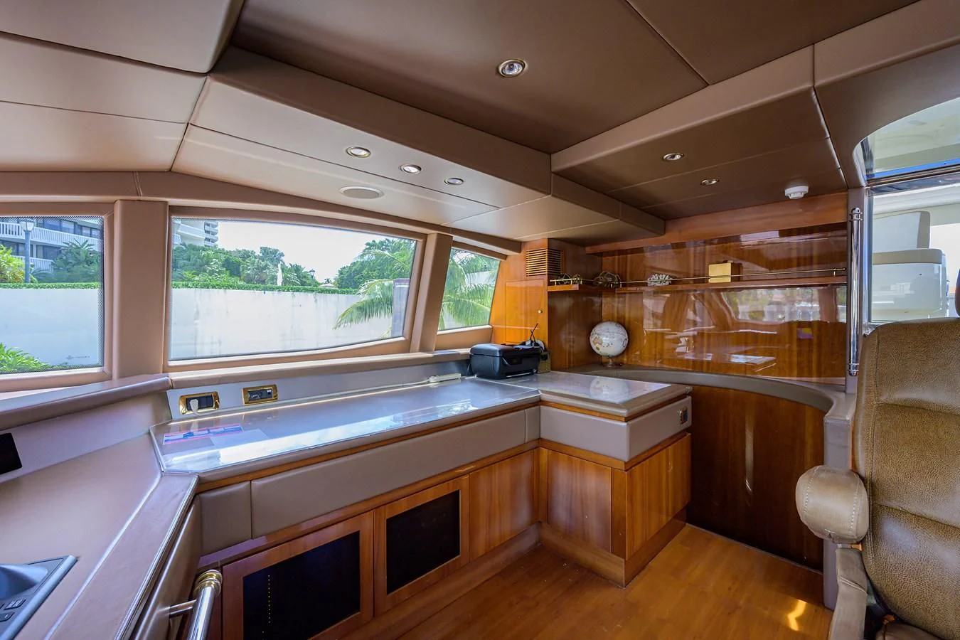 a kitchen with wooden cabinets aboard AVA Yacht for Sale