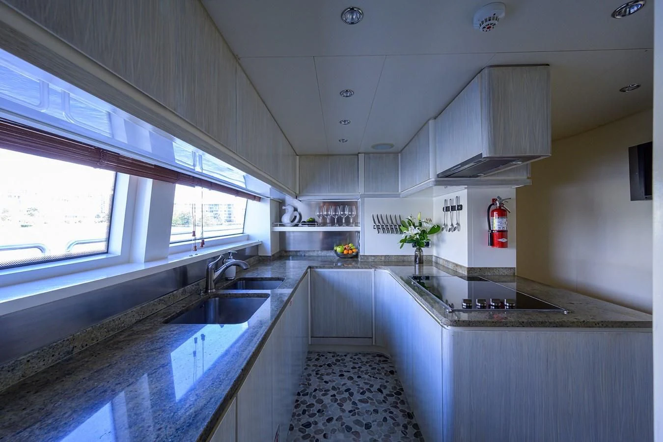a kitchen with a sink and cabinets aboard AVA Yacht for Sale