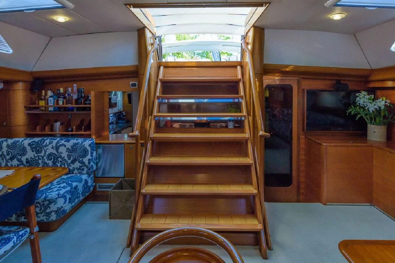 a room with a wood staircase aboard ZANZIBAR Yacht for Sale