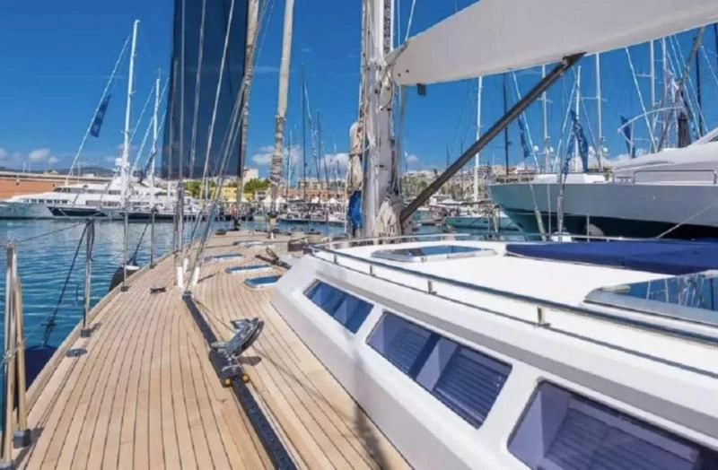 a boat dock with many boats aboard ZANZIBAR Yacht for Sale