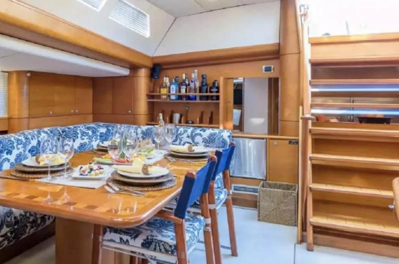 a table with plates and glasses on it aboard ZANZIBAR Yacht for Sale