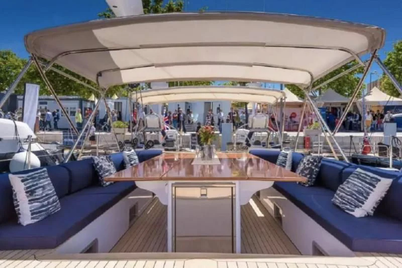 a large white tent with a table and chairs on a patio aboard ZANZIBAR Yacht for Sale