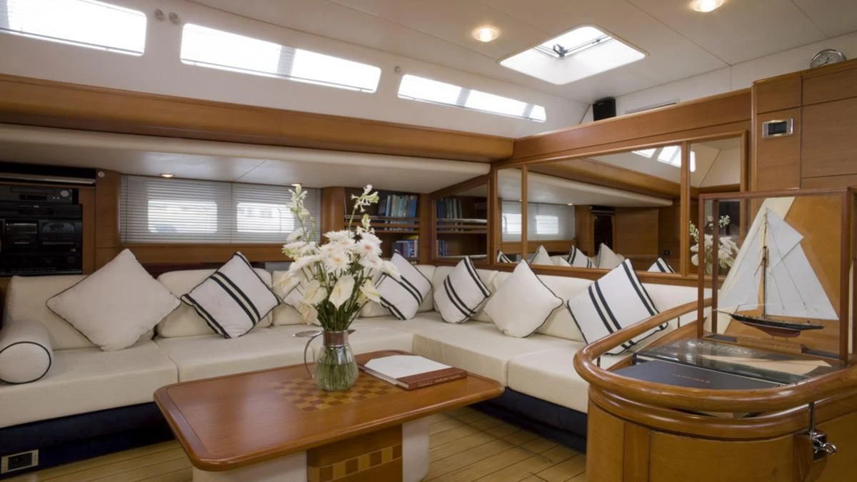 a living room with a white couch and a table aboard ZANZIBAR Yacht for Sale