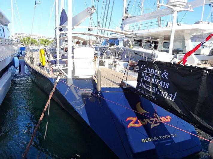 a boat docked at a pier aboard ZANZIBAR Yacht for Sale