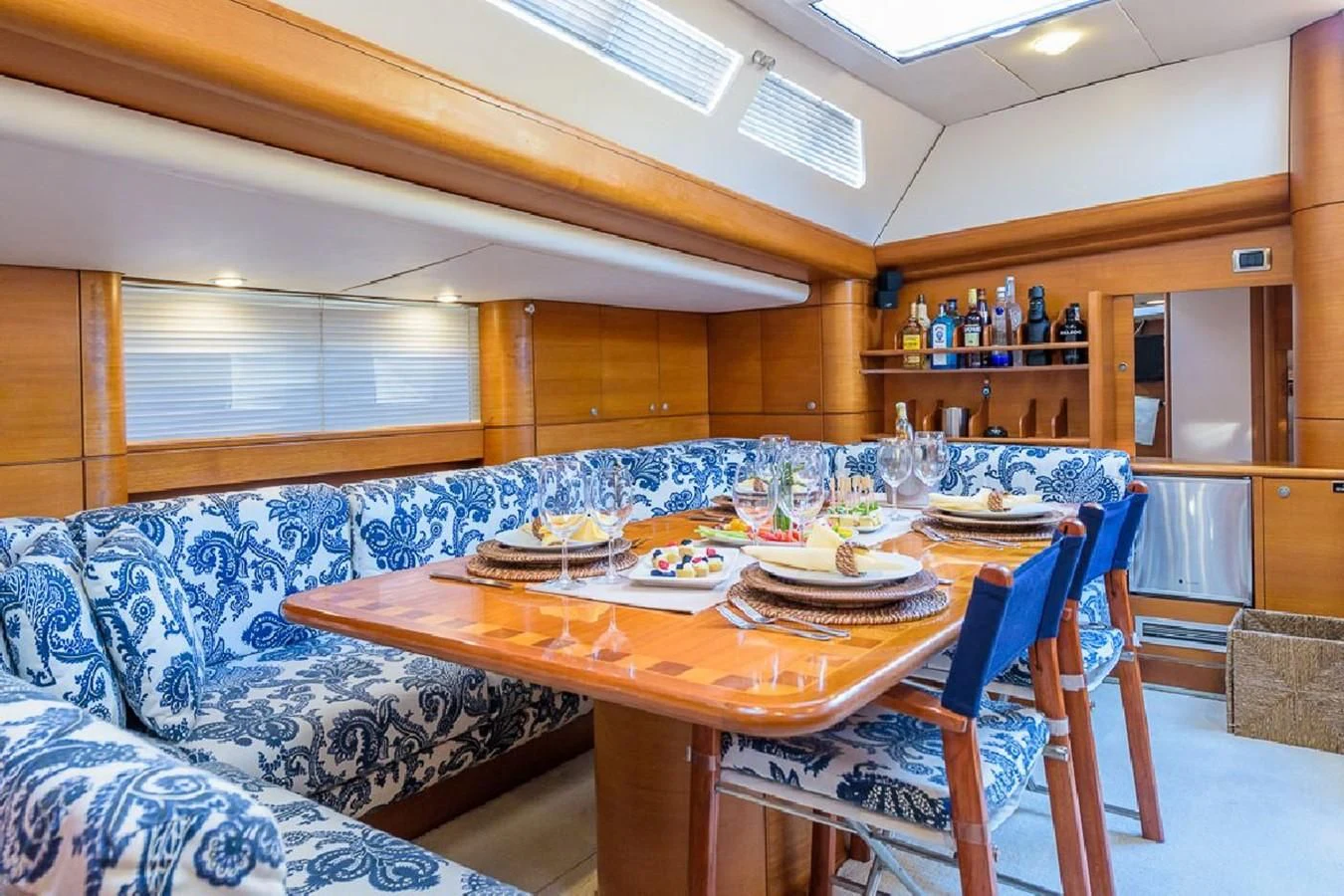 a dining table in a room aboard ZANZIBAR Yacht for Sale