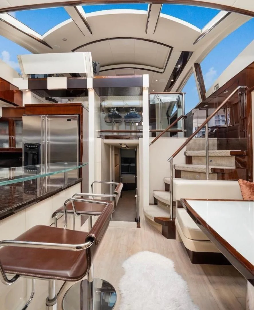a room with a bed and a desk aboard XCELL Yacht for Sale