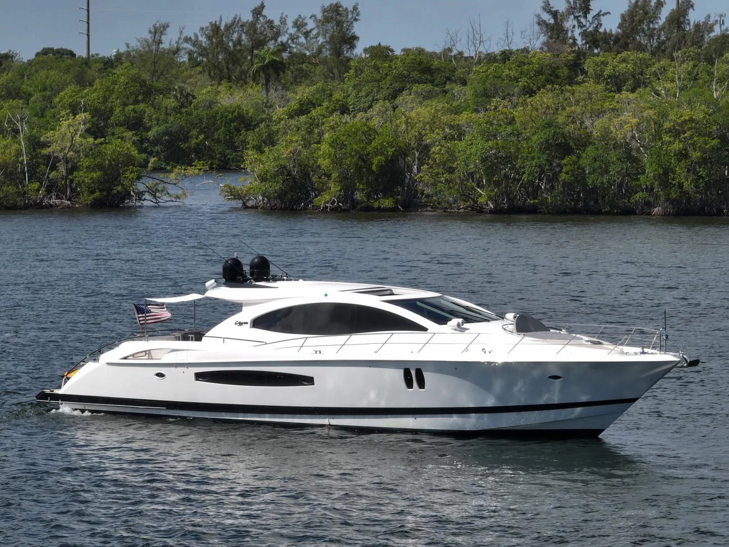 a white yacht in the water aboard XCELL Yacht for Sale