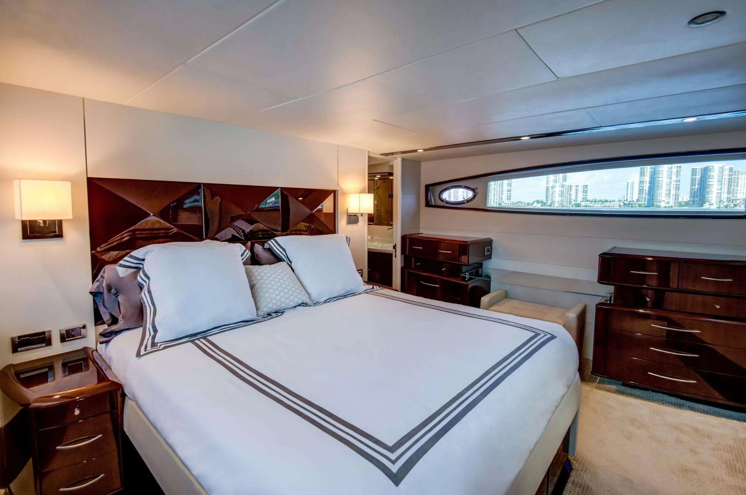a bedroom with a large bed aboard XCELL Yacht for Sale