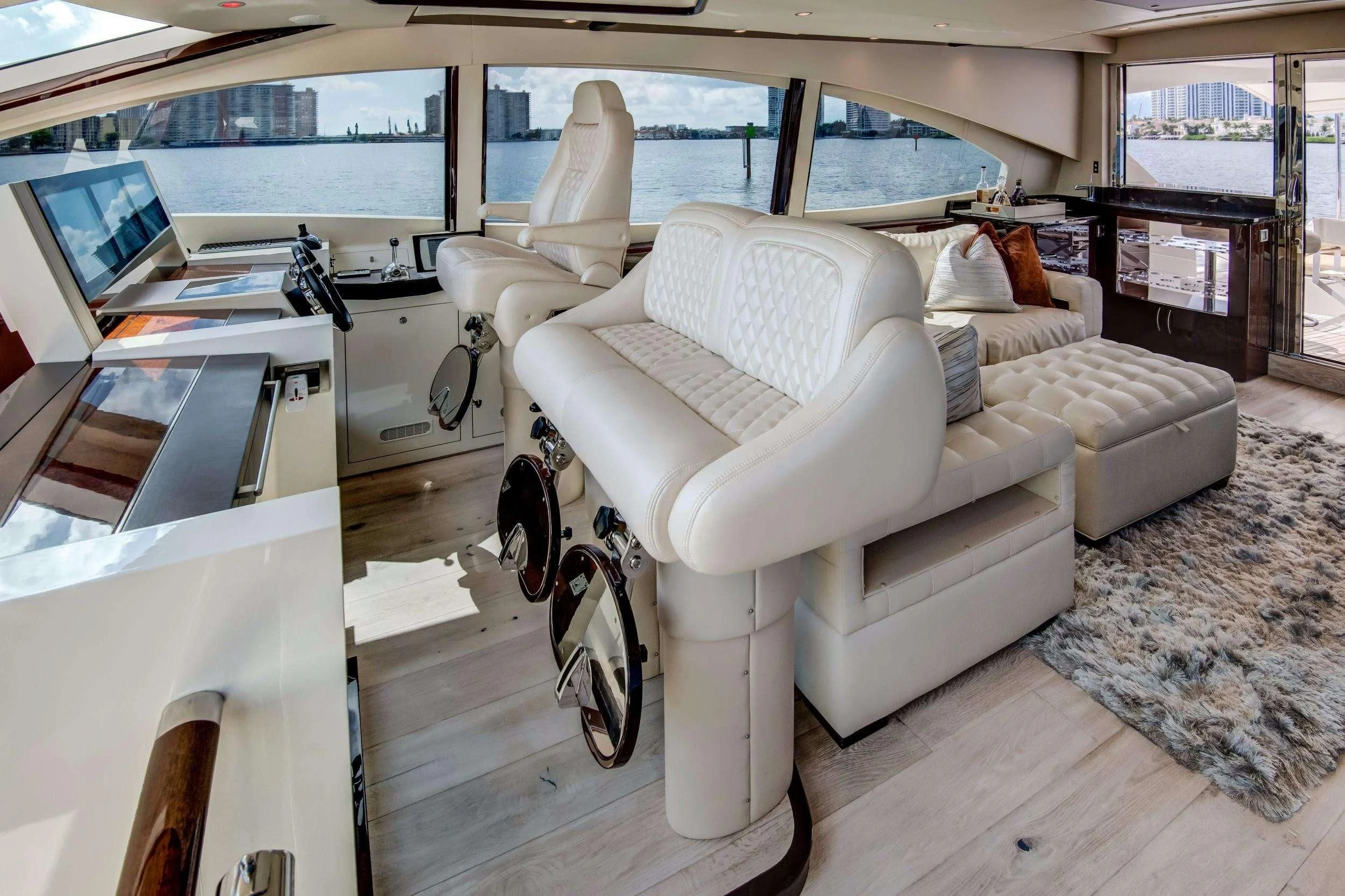 a white chair in a room aboard XCELL Yacht for Sale