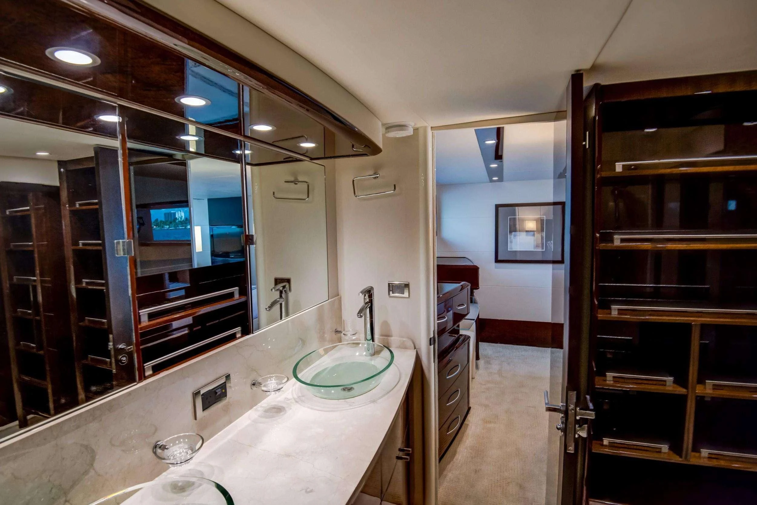 a bathroom with a large mirror aboard XCELL Yacht for Sale