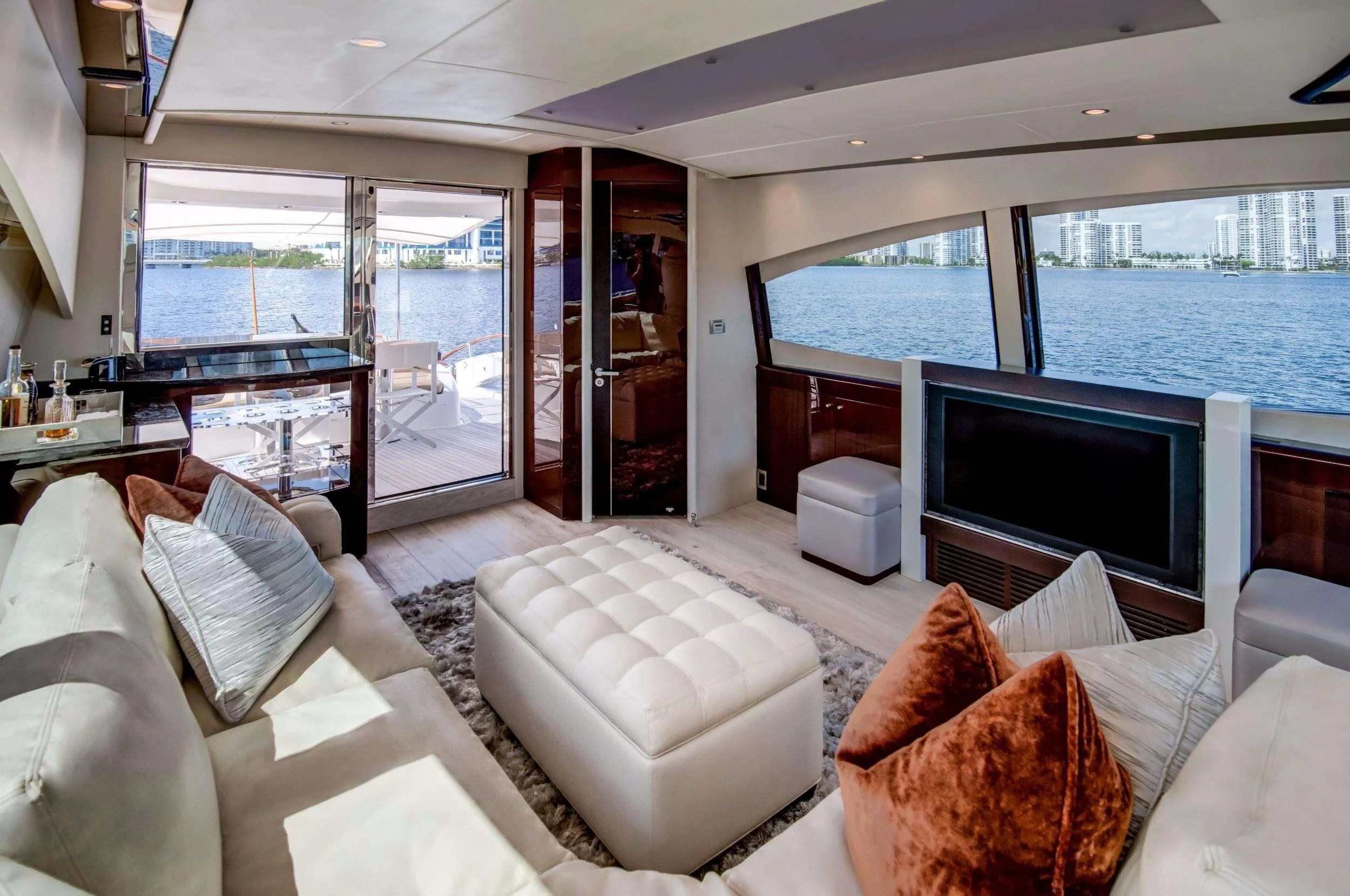 a living room with a large window aboard XCELL Yacht for Sale