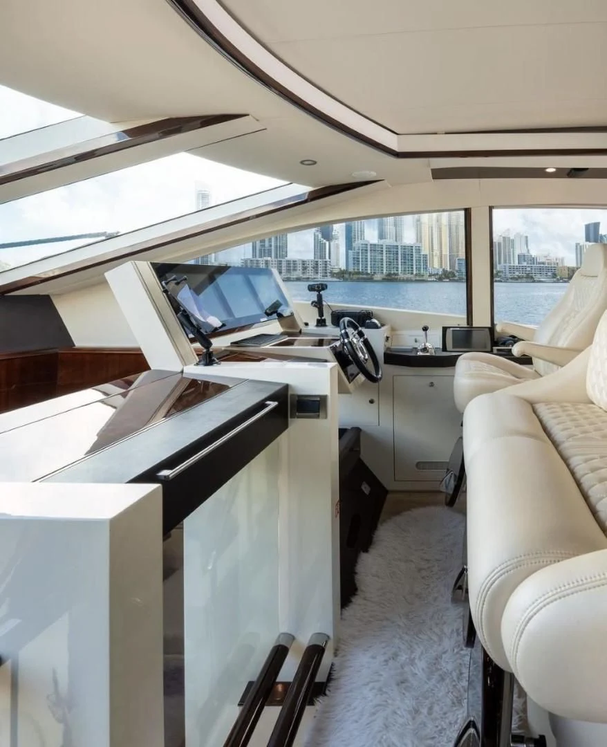 a boat with a desk and chairs aboard XCELL Yacht for Sale