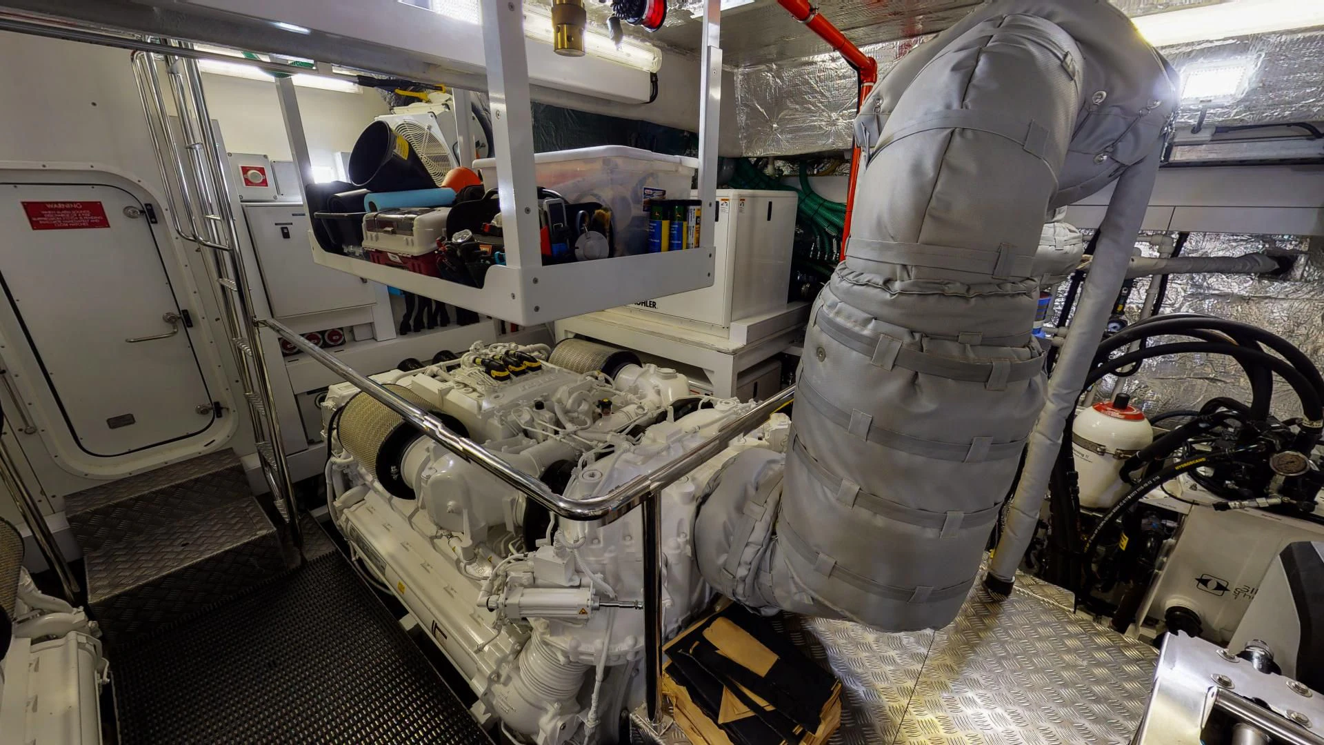 a person in a white suit working in a factory aboard PV 95 Yacht for Sale