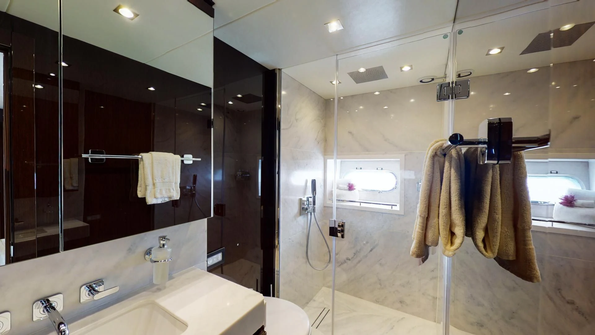 a bathroom with a large mirror aboard PV 95 Yacht for Sale