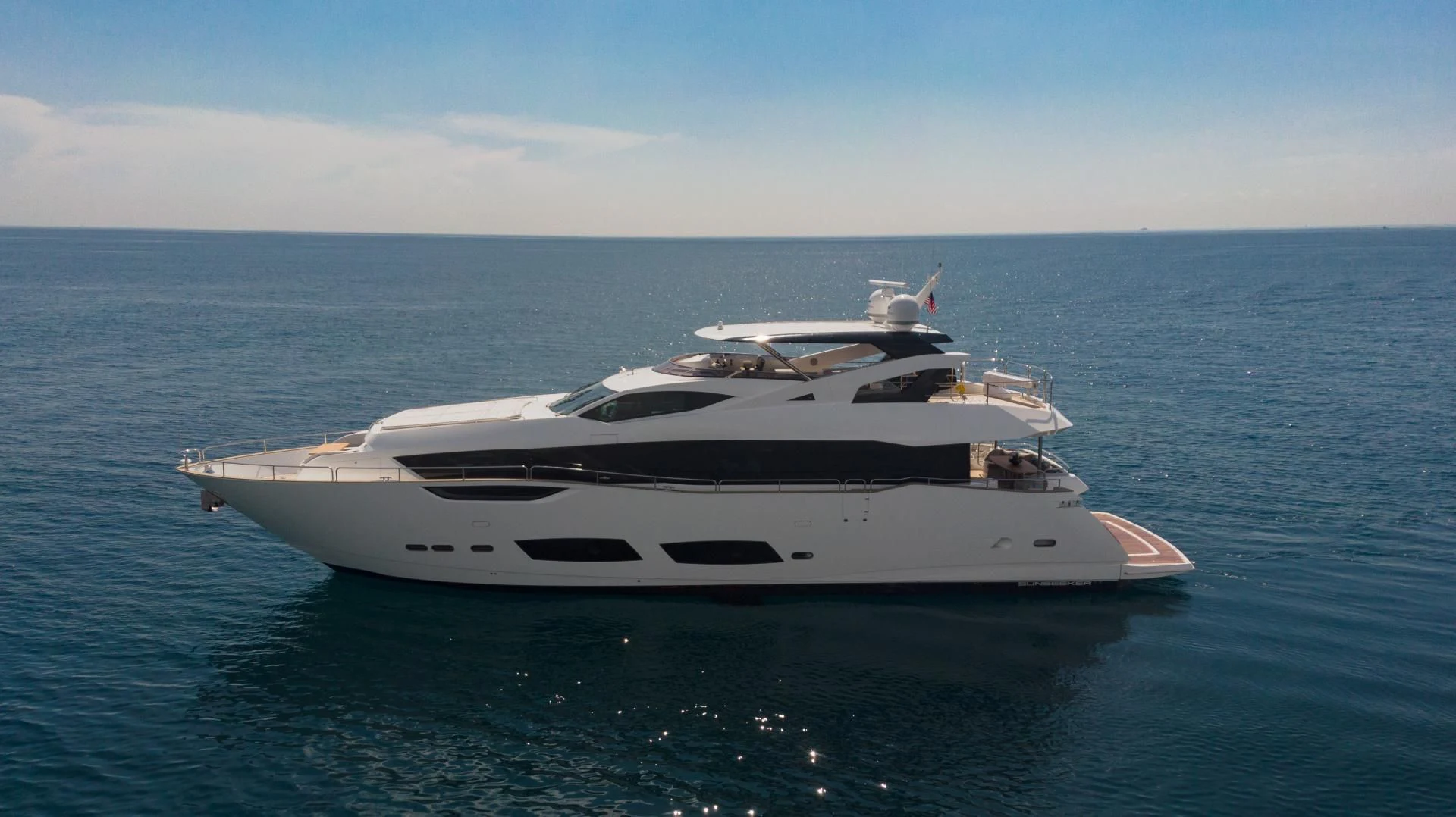 a white yacht in the water aboard PV 95 Yacht for Sale