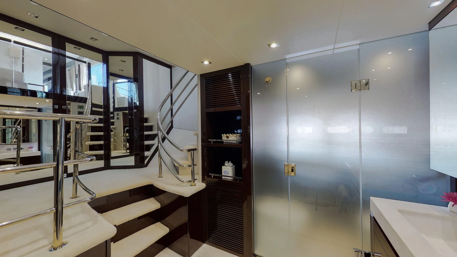 a room with a glass wall and a staircase aboard PV 95 Yacht for Sale