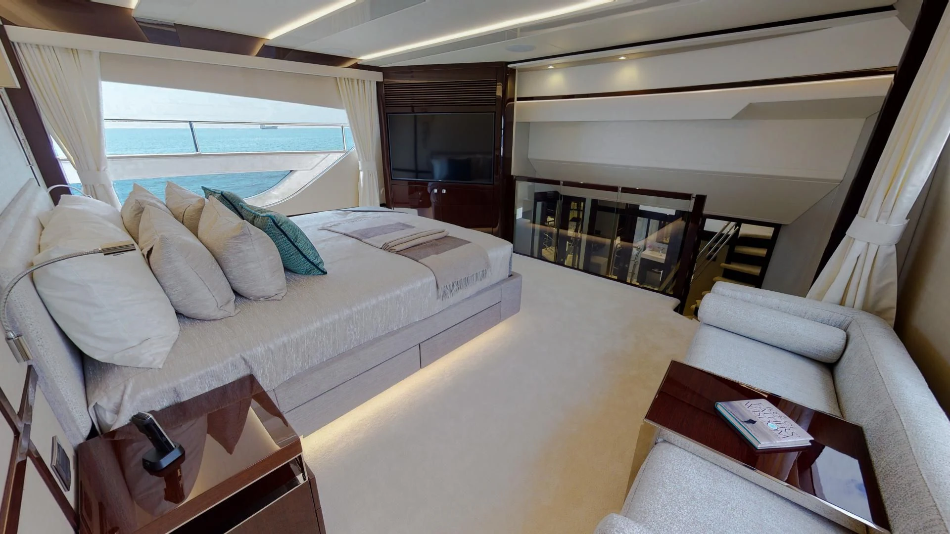a room with a bed and a table aboard PV 95 Yacht for Sale