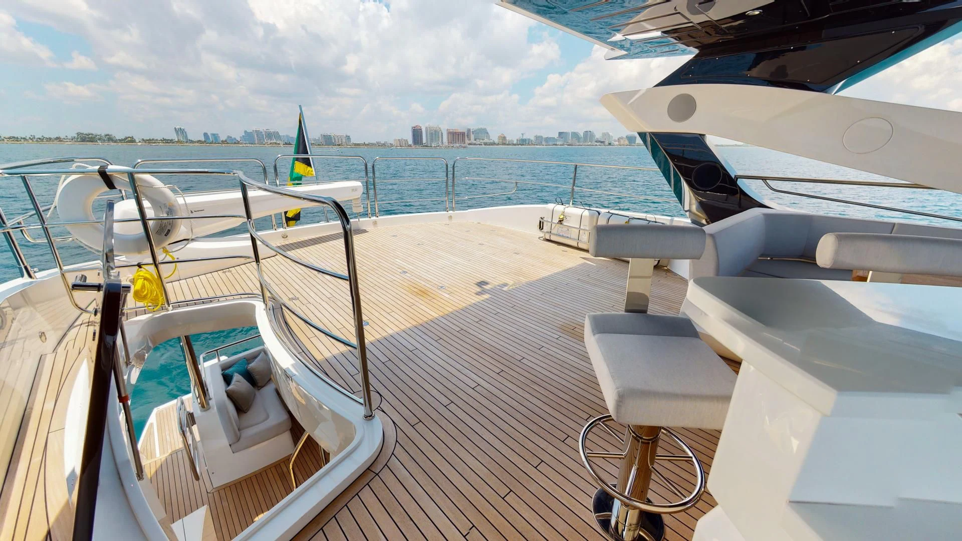a deck with chairs and a boat on it aboard PV 95 Yacht for Sale