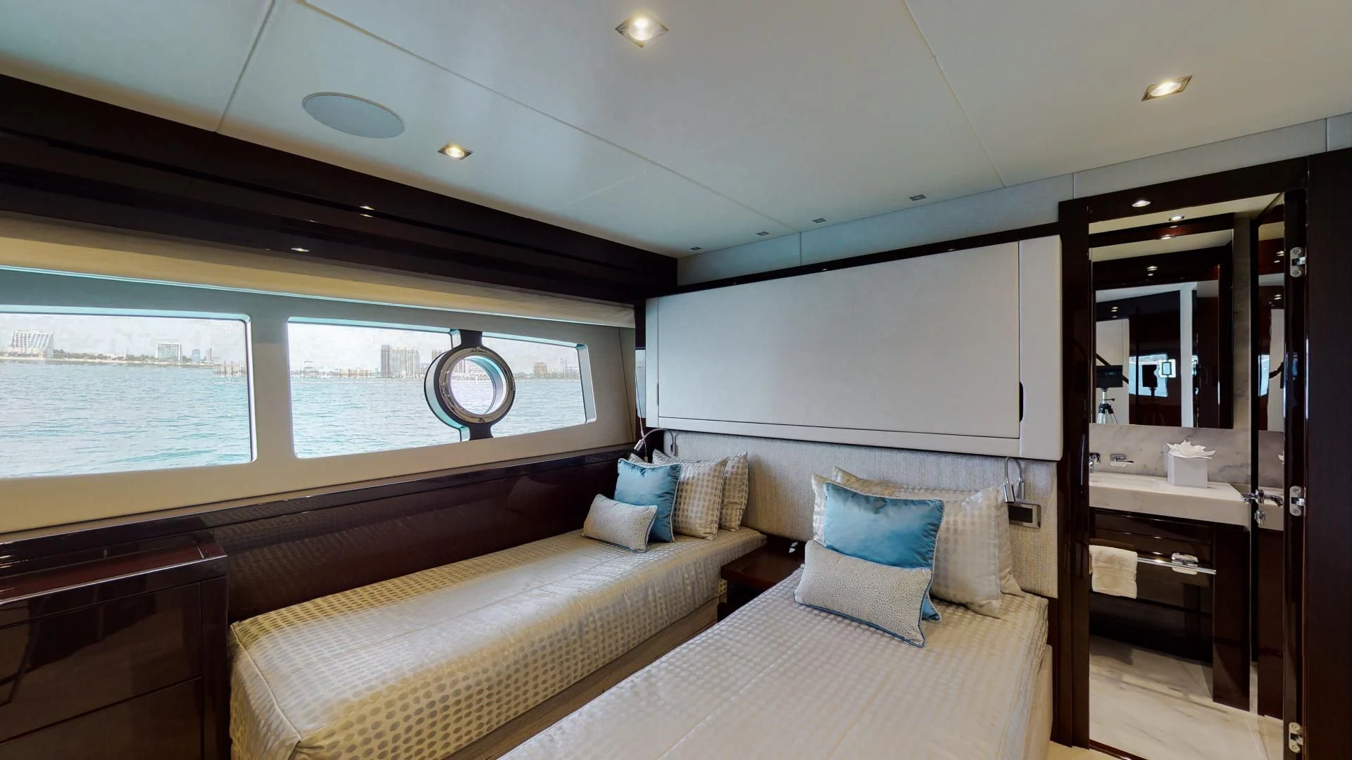 a bedroom with a bed and a large window aboard PV 95 Yacht for Sale