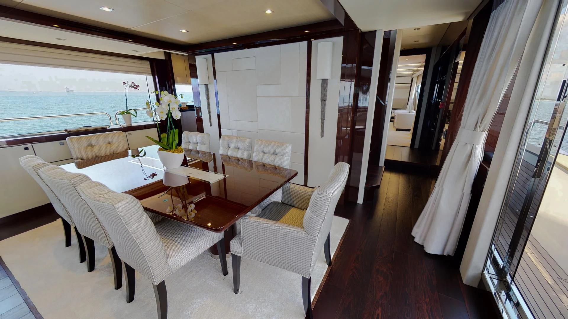 a room with a table chairs and a window aboard PV 95 Yacht for Sale