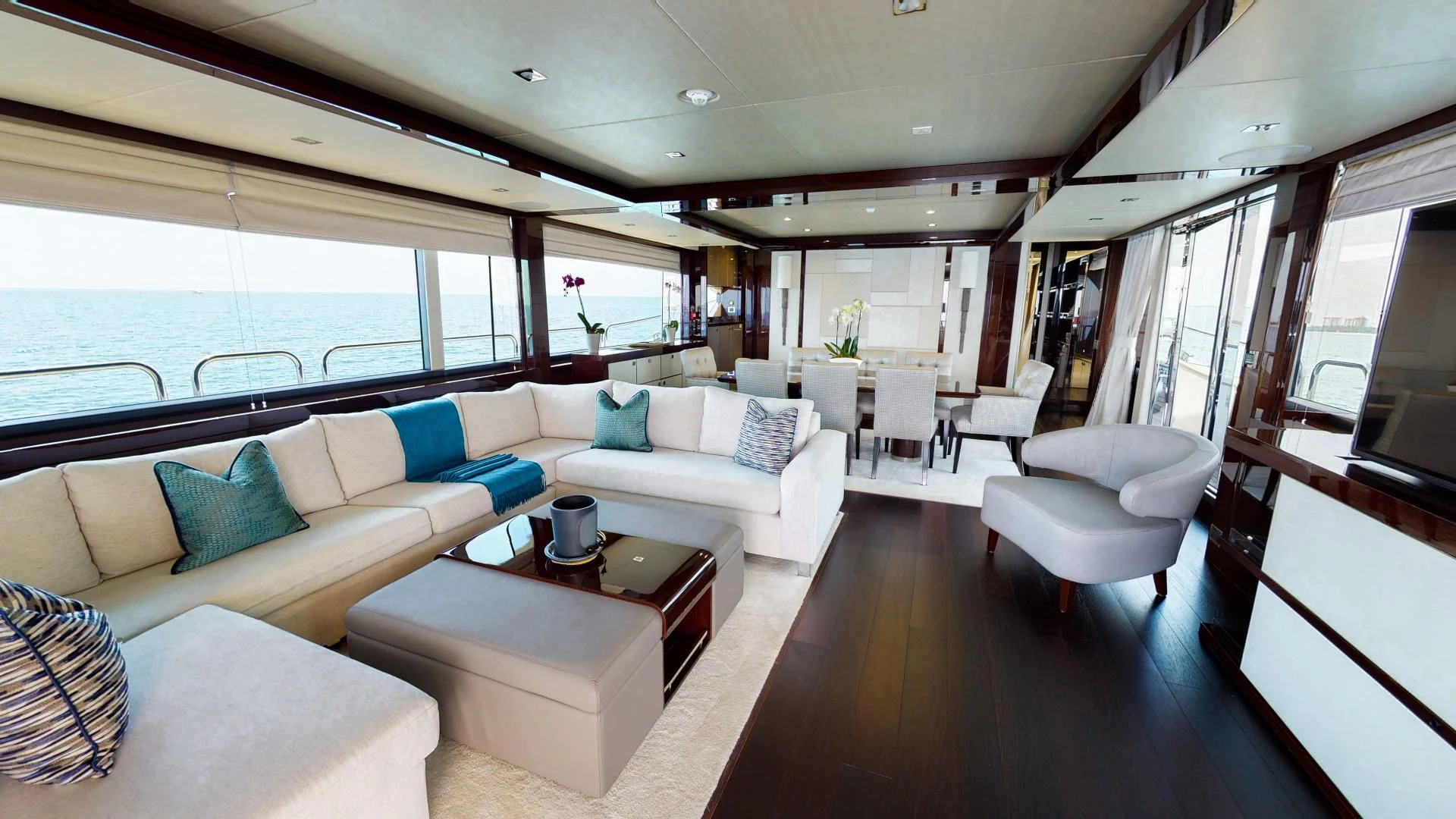 a living room with a couch and a coffee table aboard PV 95 Yacht for Sale