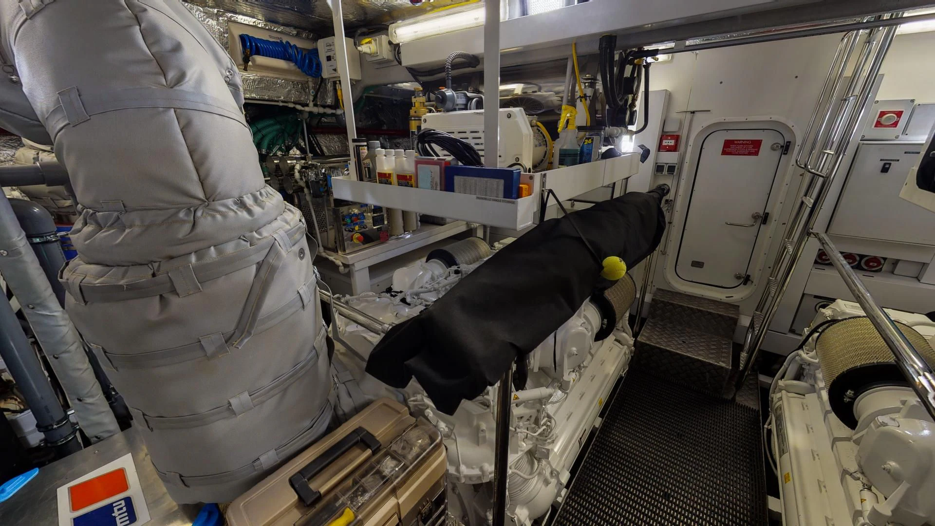 a person in a room with equipment aboard PV 95 Yacht for Sale