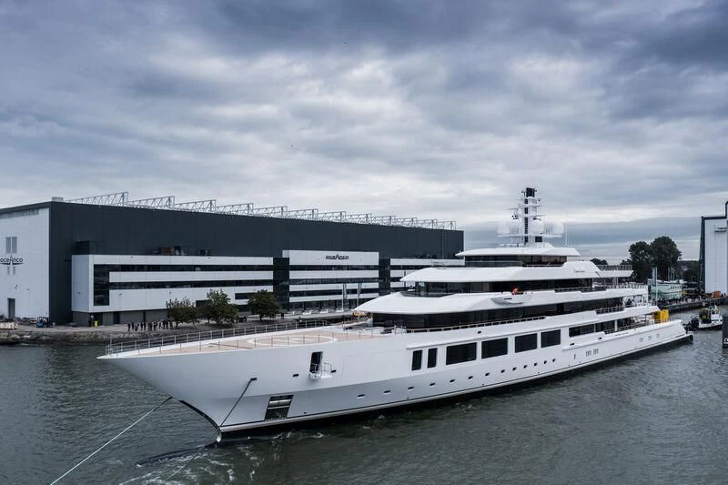 a large white ship in a harbor aboard INFINITY Yacht for Sale