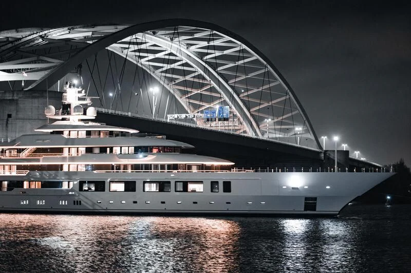 a large cruise ship in a harbor aboard INFINITY Yacht for Sale