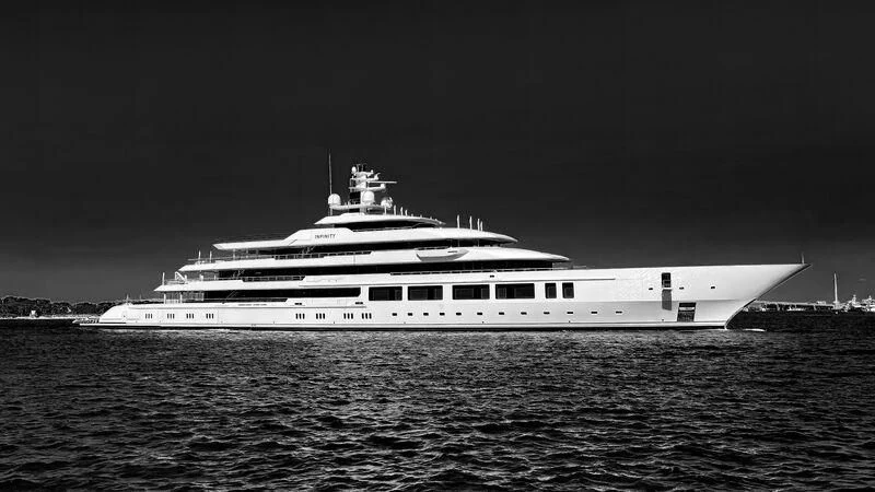 a large ship in the water aboard INFINITY Yacht for Sale