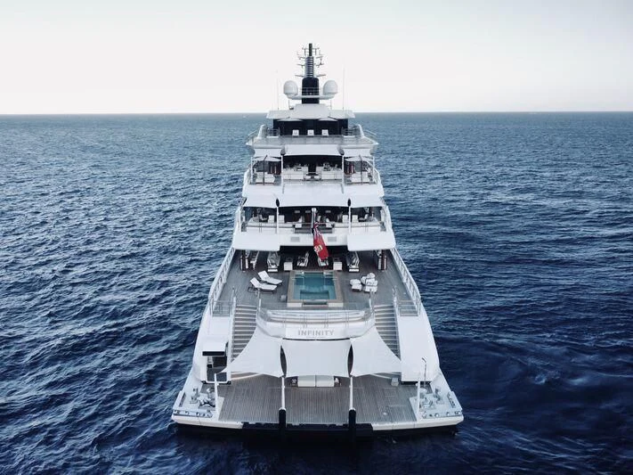a large white ship in the water aboard INFINITY Yacht for Sale
