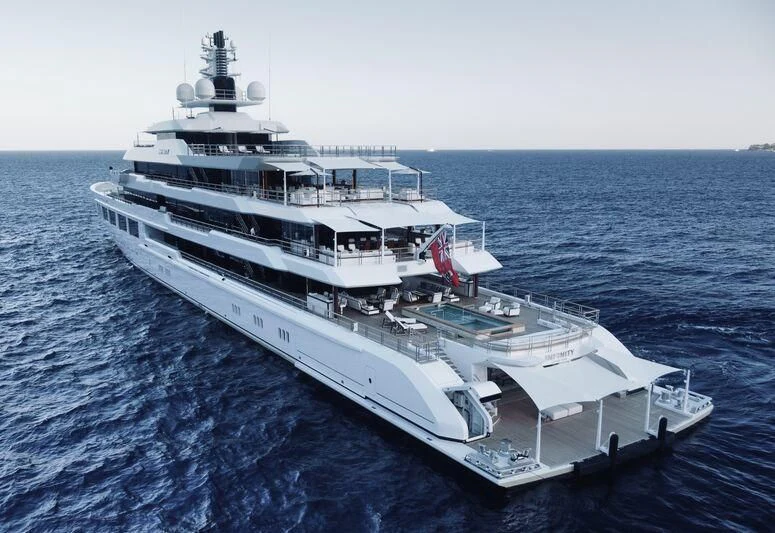 a large white boat in the water aboard INFINITY Yacht for Sale