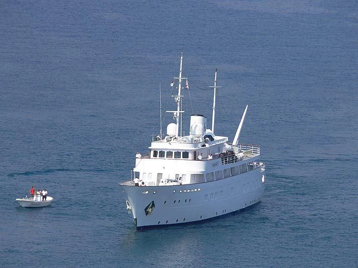 a large white boat with people on it aboard LADY K II Yacht for Sale