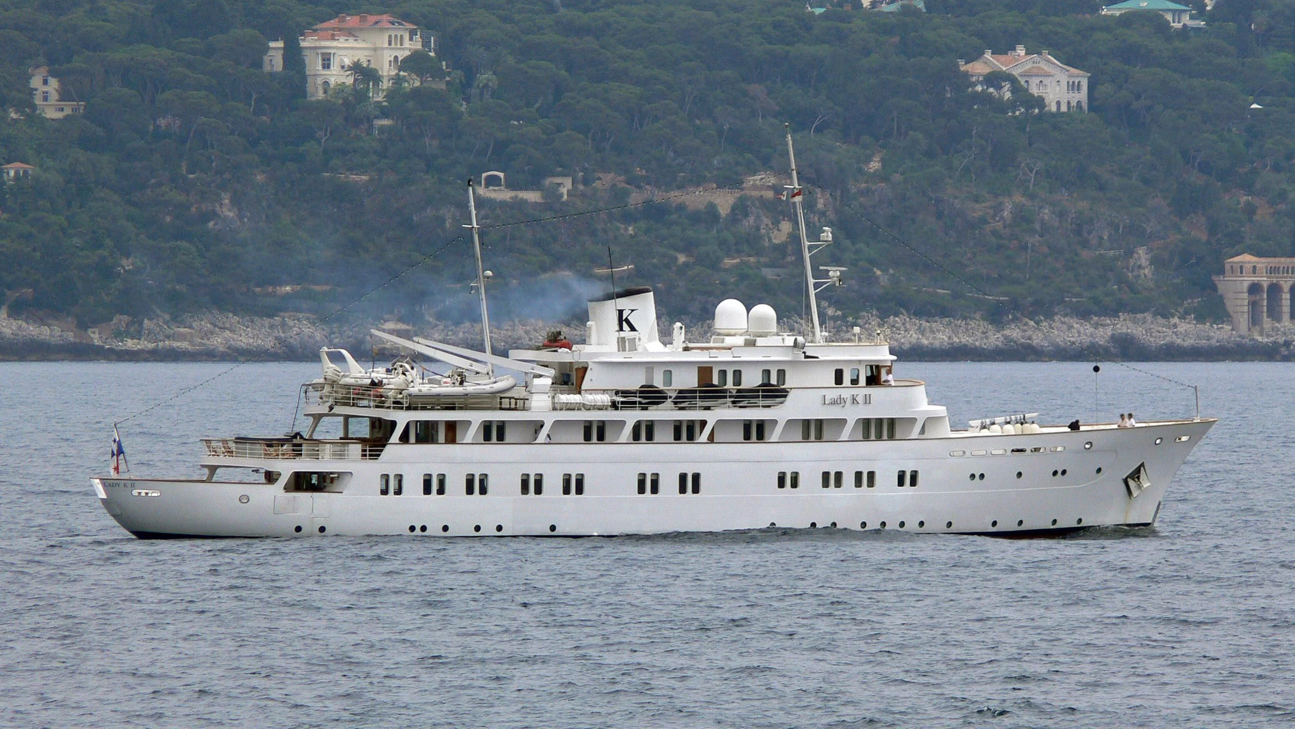 a large white boat in the water aboard LADY K II Yacht for Sale