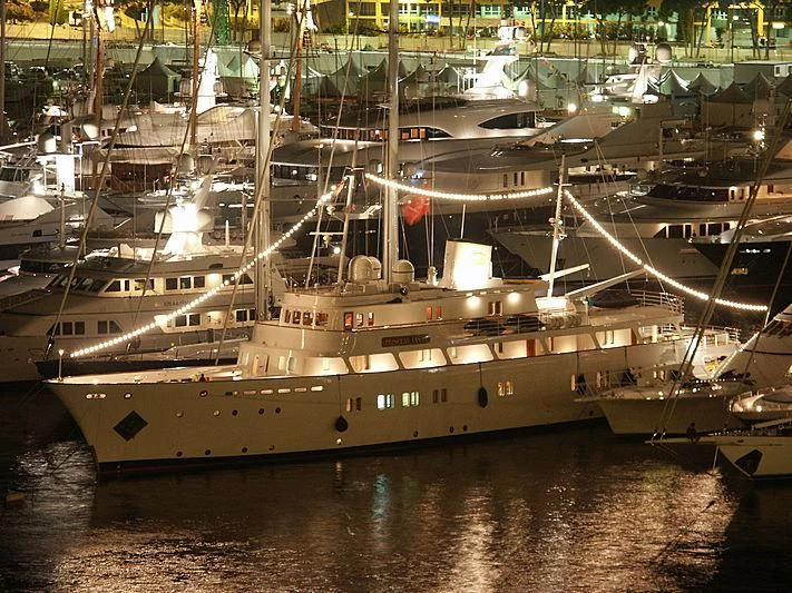 a large ship in a harbor aboard LADY K II Yacht for Sale