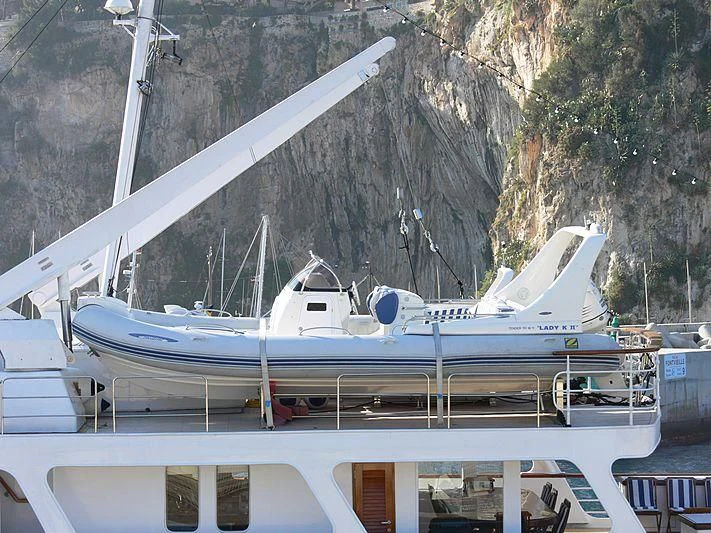 a boat docked at a pier aboard LADY K II Yacht for Sale
