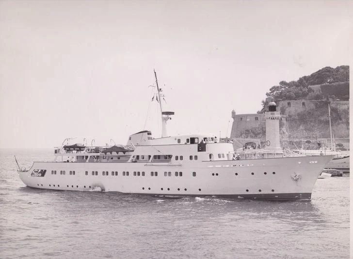 a large ship in the water aboard LADY K II Yacht for Sale