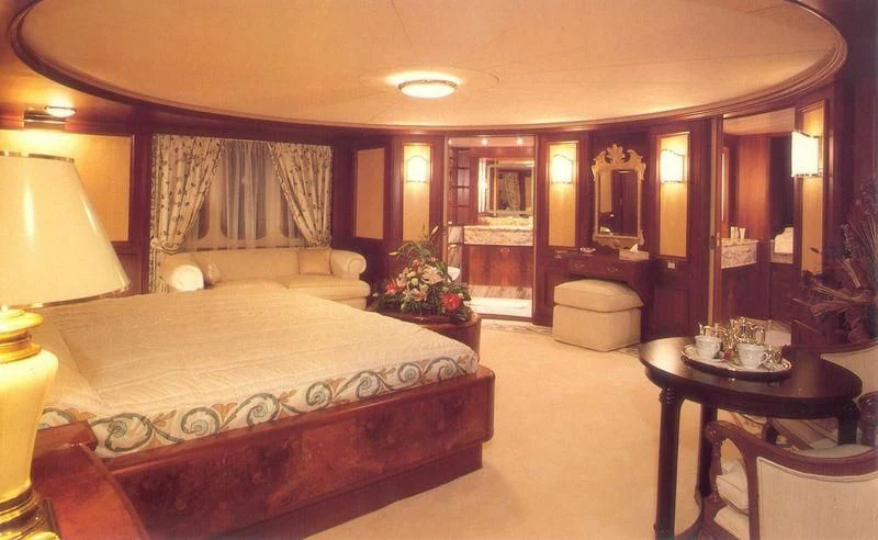 a large hotel room with a large bed and a table aboard LADY K II Yacht for Sale