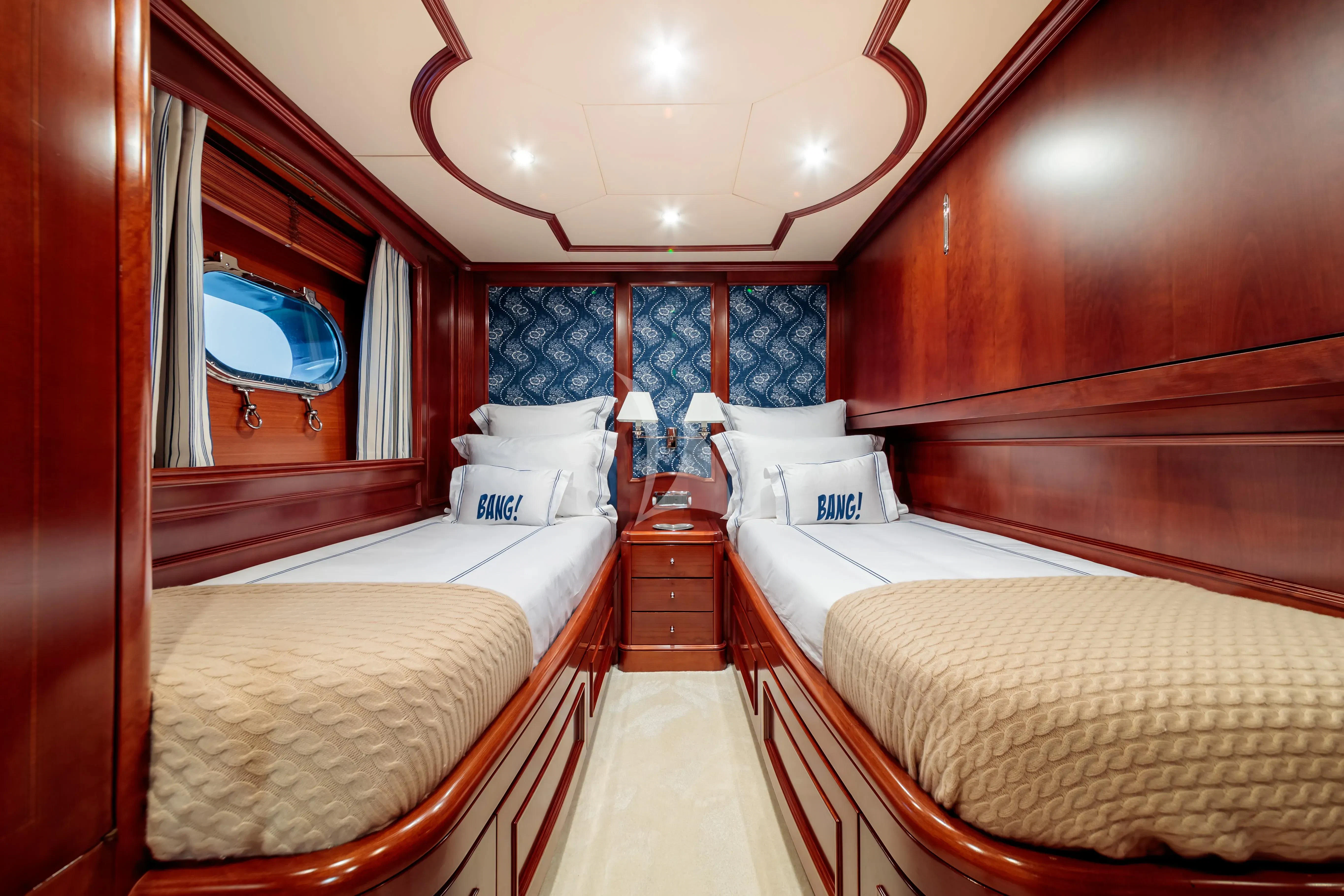 a room with double beds aboard BANG! Yacht for Charter