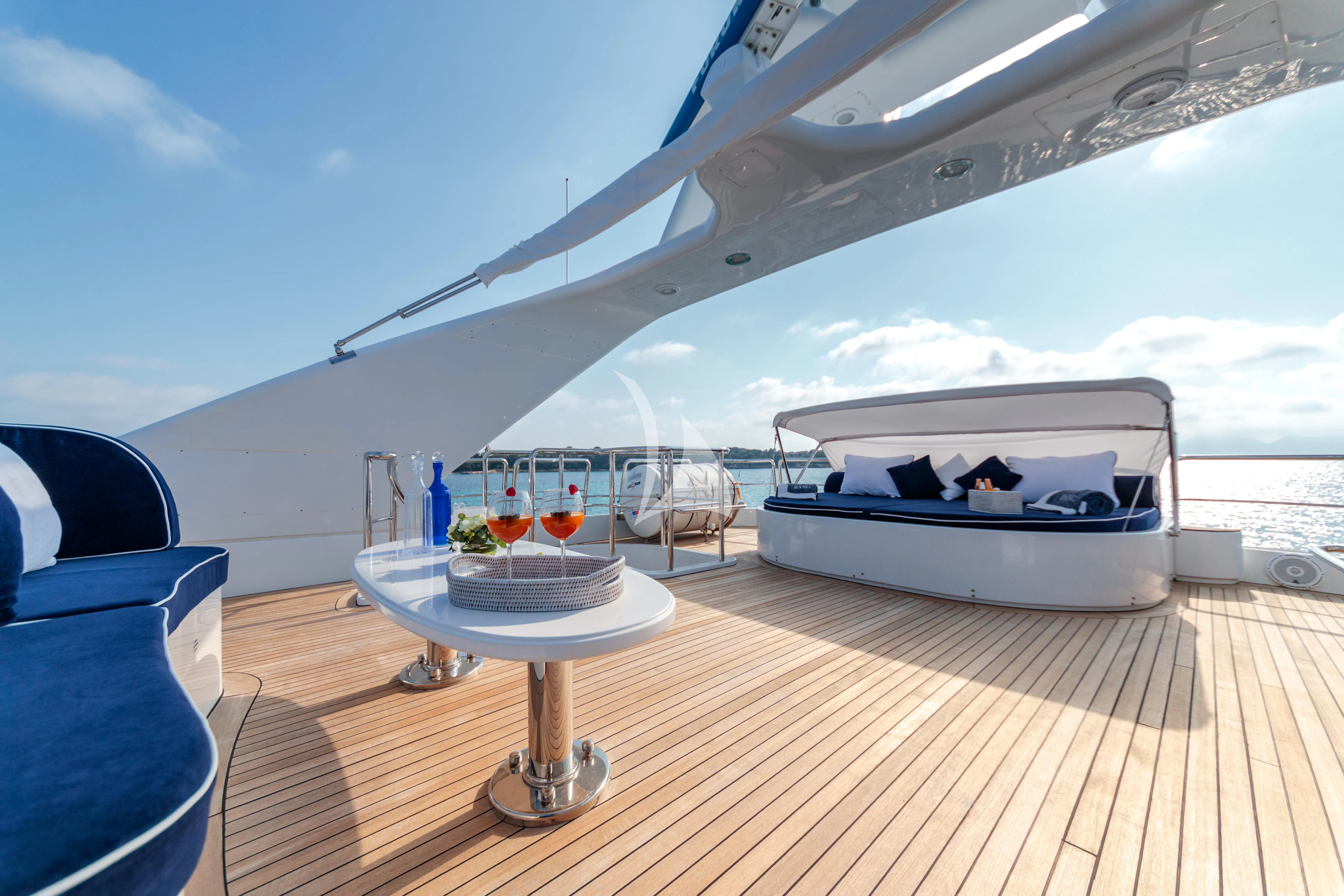 a boat on a deck aboard BANG! Yacht for Charter