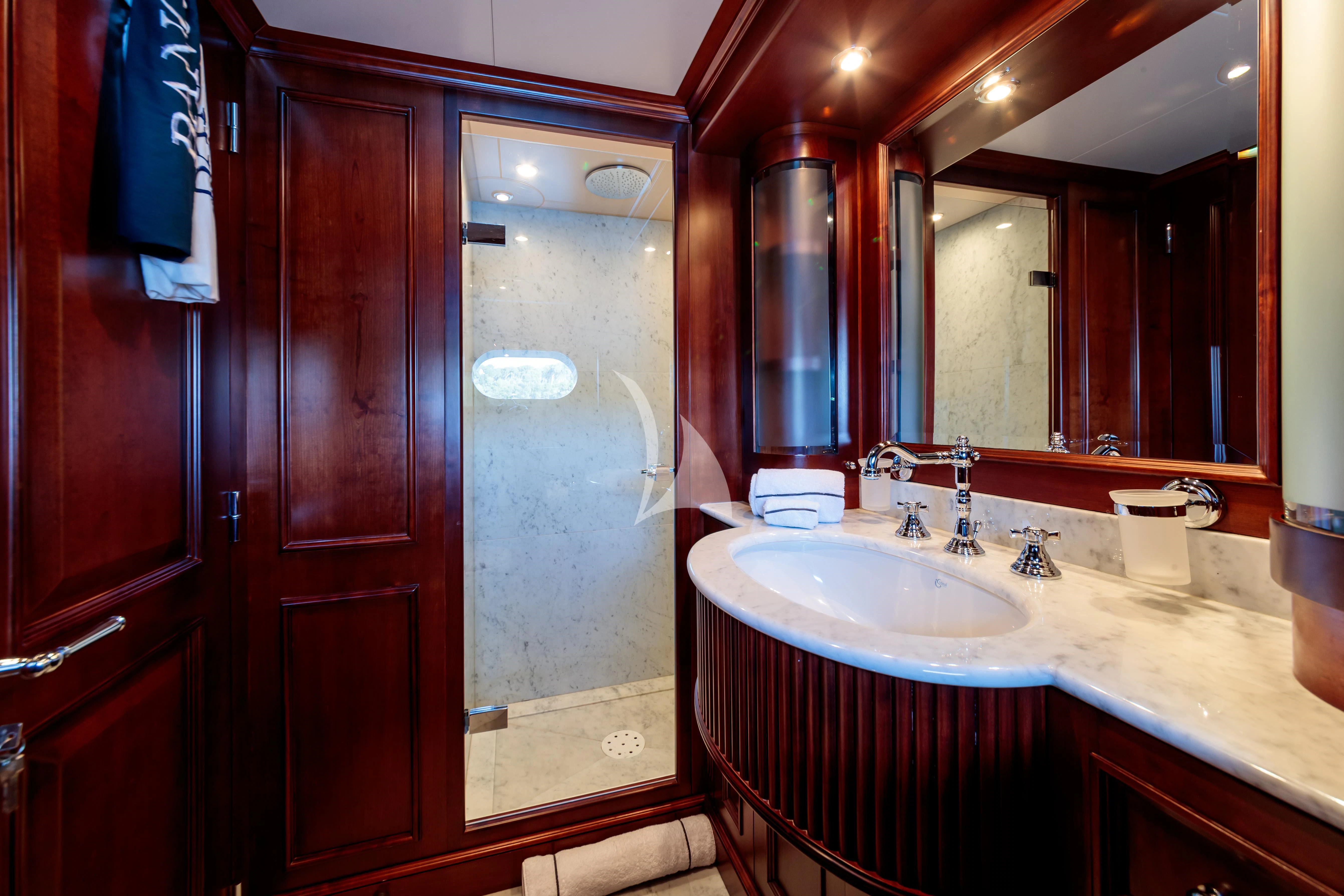 a bathroom with a sink and a mirror aboard BANG! Yacht for Charter