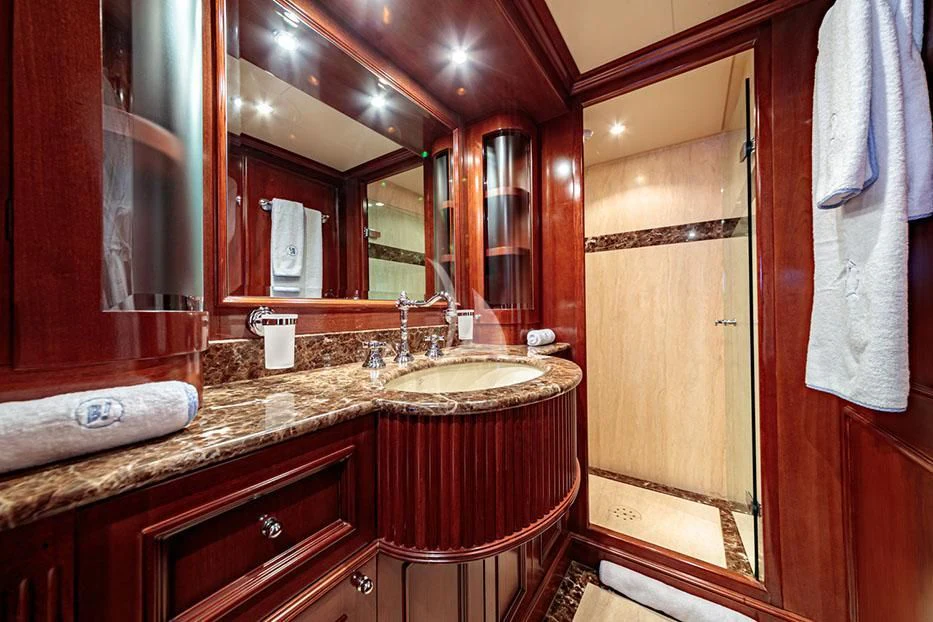 a bathroom with a large mirror aboard BANG! Yacht for Charter